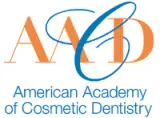 The american academy of cosmetic dentistry logo. 