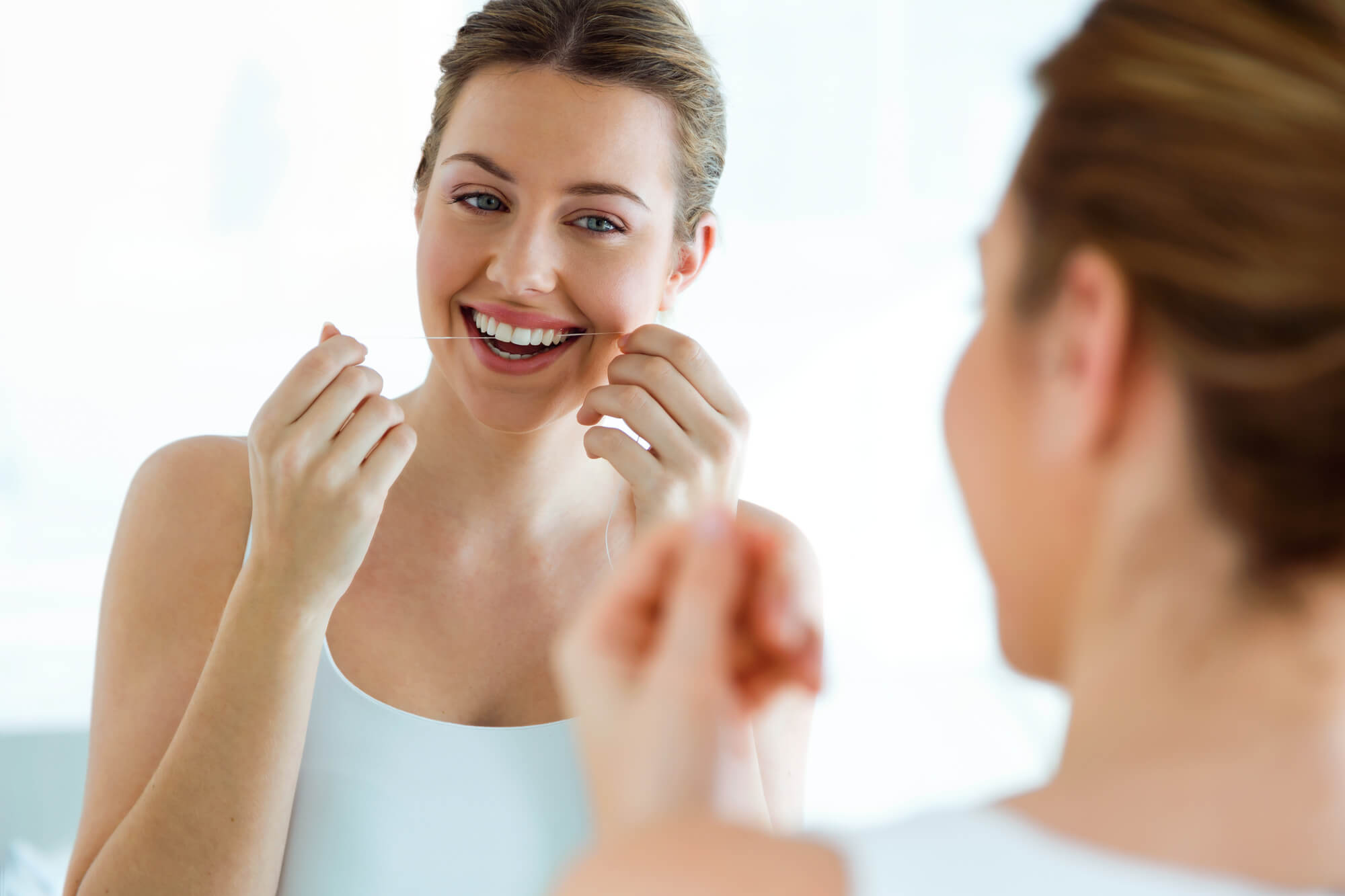 cosmetic dentist greenville sc recommends flossing teeth