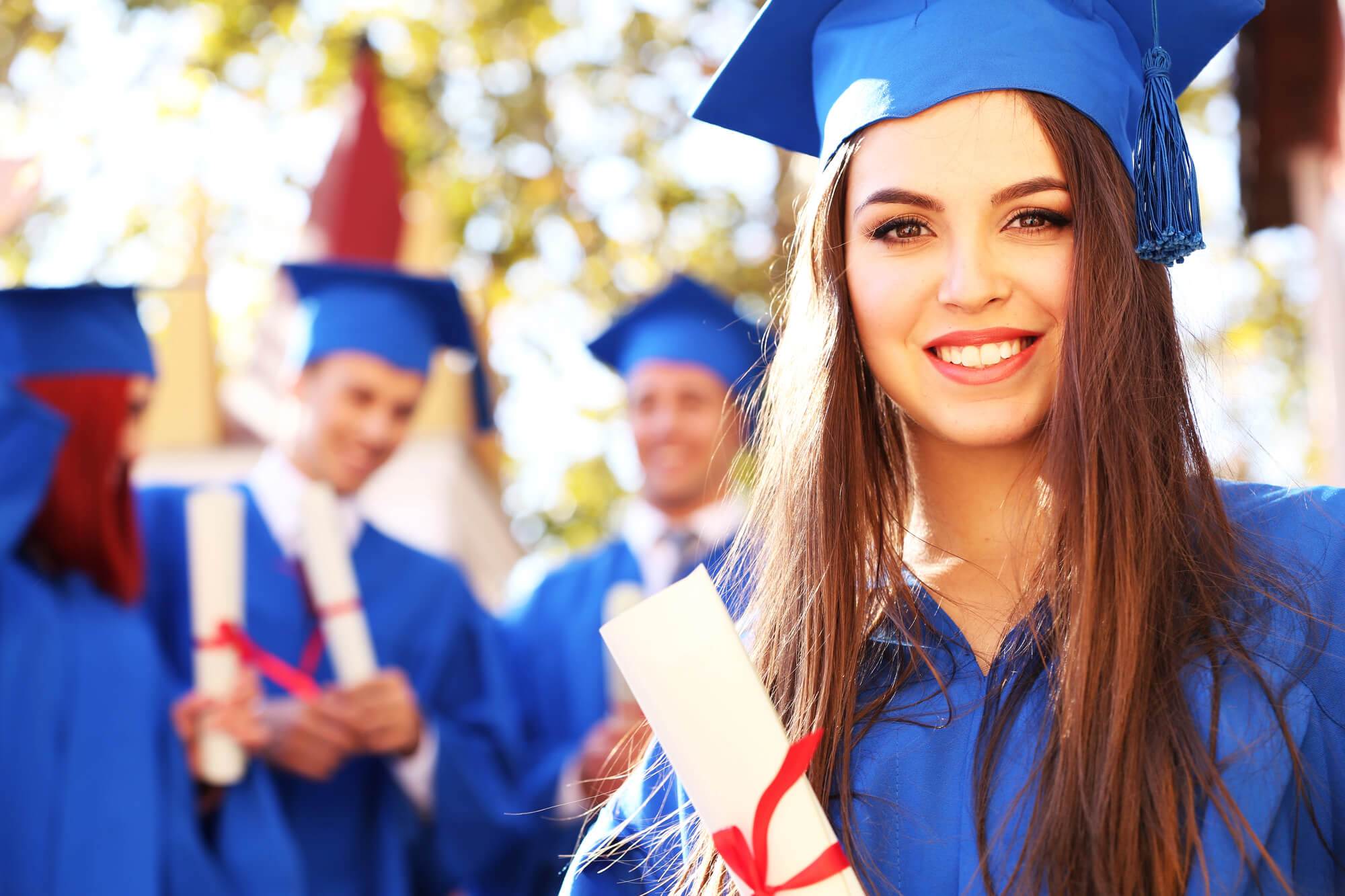 woman-showing-white-smile-in-graduation-after-teeth-whitening-simpsonville